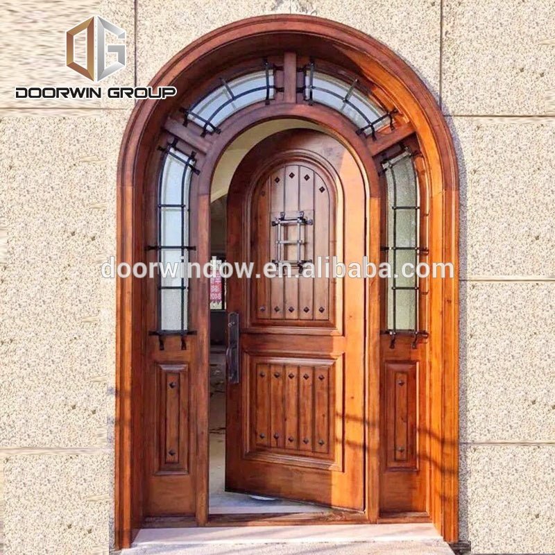 Arched decorative wrought iron clavos exterior doors , front door for home by Doorwin - Doorwin Group Windows & Doors