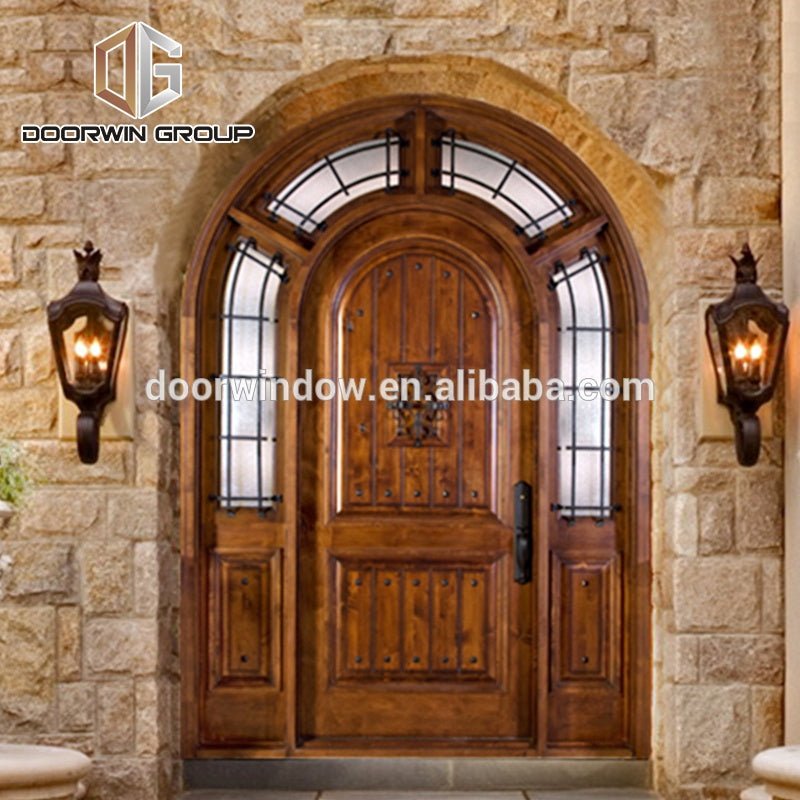 Arched decorative wrought iron clavos exterior doors , front door for home by Doorwin - Doorwin Group Windows & Doors