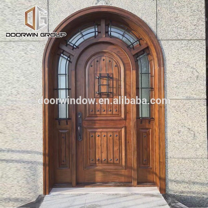 Arched decorative wrought iron clavos exterior doors , front door for home by Doorwin - Doorwin Group Windows & Doors