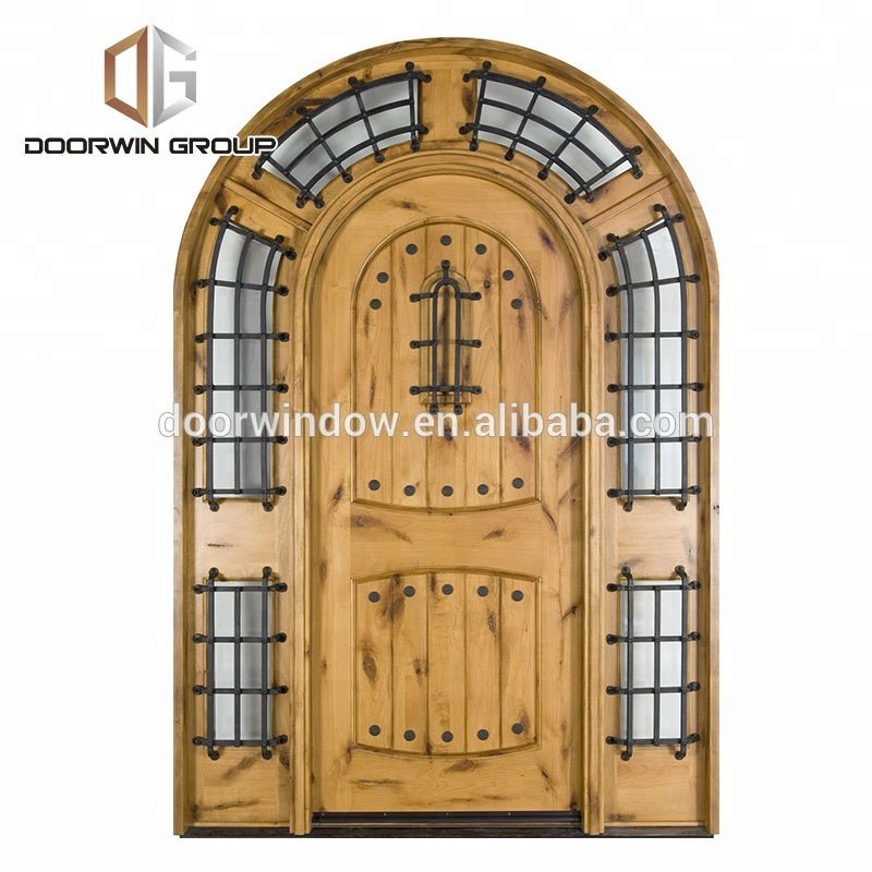 Arched top iron clavos door design with Q-Lon weather strip insulation and solid wood front door frame by Doorwin - Doorwin Group Windows & Doors