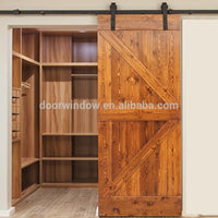 Hanging sliding barn door with wooden sliding door roller by Doorwin — thumbnail 3
