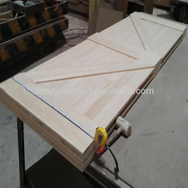Hanging sliding barn door with wooden sliding door roller by Doorwin - Doorwin Group Windows & Doors
