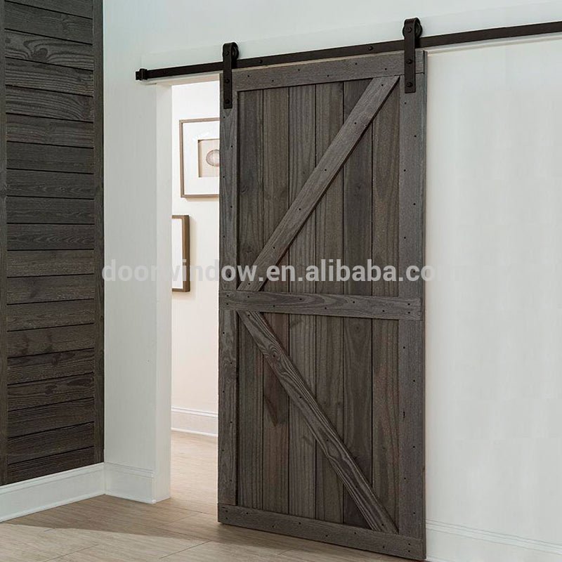 Hanging sliding barn door with wooden sliding door roller by Doorwin - Doorwin Group Windows & Doors