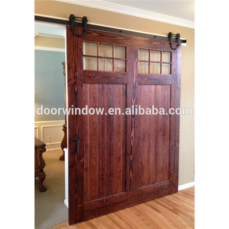 Interior wood partition design glass insert wooden barn door by Doorwin — product image 1