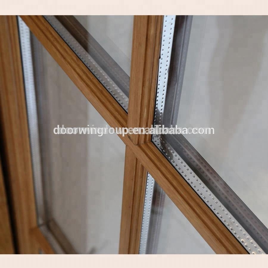 Modern grille design with Low air leakage rate performance powder coated aluminium clad wood out-swing crank handle windowby Doorwin — product image 5