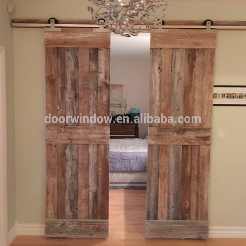 Movable plank panel wooden doors design catalogue surface stained sliding barn door for partition by Doorwin - Doorwin Group Windows & Doors