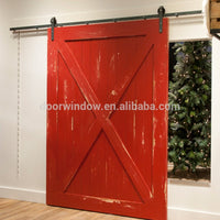 Nice looking American sliding barn door X type made of pine wood by Doorwin — thumbnail 1