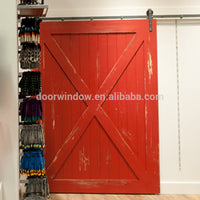 Nice looking American sliding barn door X type made of pine wood by Doorwin — thumbnail 2