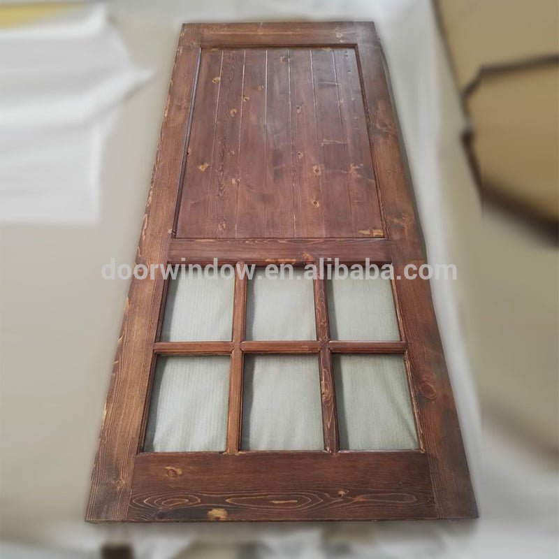 Surface stained oak wood main door designs barn door with fully tempered glass by Doorwin — product image 3