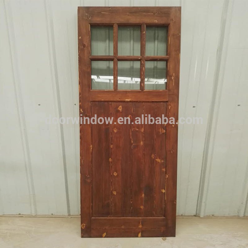 Surface stained oak wood main door designs barn door with fully tempered glass by Doorwin — product image 2