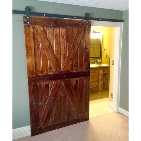 Vintage X Brace Wood Barn Sliding Doors by Doorwin — product image 1