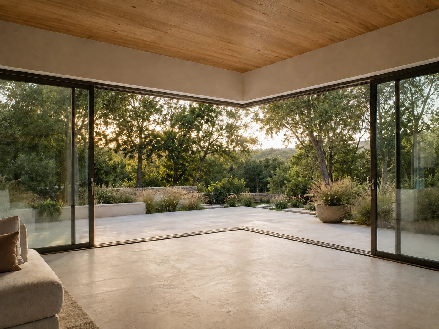 Architectural concept: parallel sliding glass panels open a post-free corner toward a garden terrace.